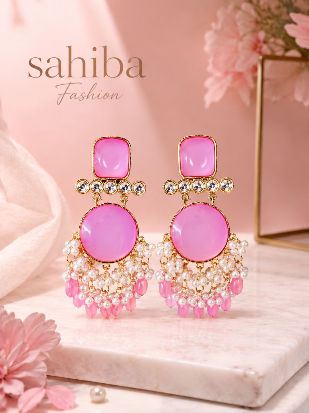 elegant pink stone pearl dangler earrings for women – traditional ethnic statement jewelry Elegant pink stone and pearl dangler earrings with gold-tone detailing, showcased in a luxury jewelry mockup by Sahiba Fashion.