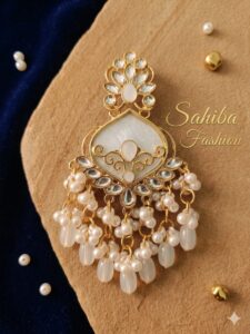 Milky white enamel earring with Kundan stones and white pearl drops.