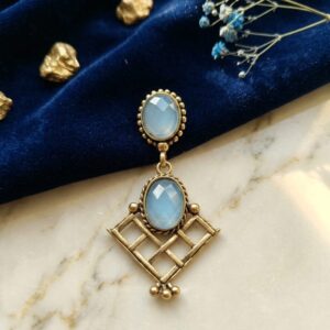 Silver-plated layered hoop earrings with white crystals and navy blue teardrop glass beads.