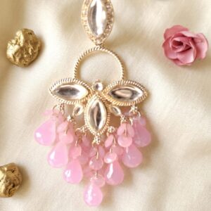 Traditional Indian Chandbali earrings with pink beads, pearls, and kundan stone work.