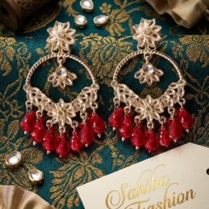 Gold-plated kundan hoop earrings with ruby red bead drops and floral motifs.