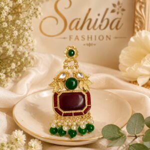 Red stone golden earrings with green beads, pearl detailing and peacock-inspired design