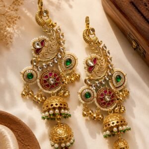 Golden heavy statement earrings with green and pink stones, pearl detailing and double jhumka drops