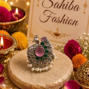 Peacock shaped silver stud earring with pink stone, green stones and pearl detailing
