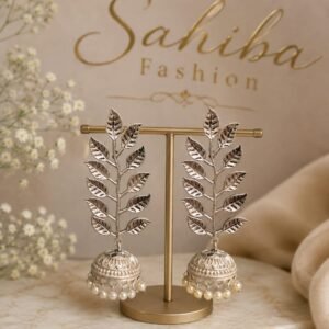 New Arrivals Pair of Sahiba Fashion silver leaf pattern jhumka earrings featuring pearl drop accents on a earring stand.