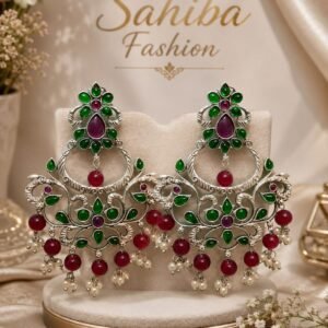 Sahiba Fashion silver chandelier earrings with green stone embellishments and hanging red bead drops